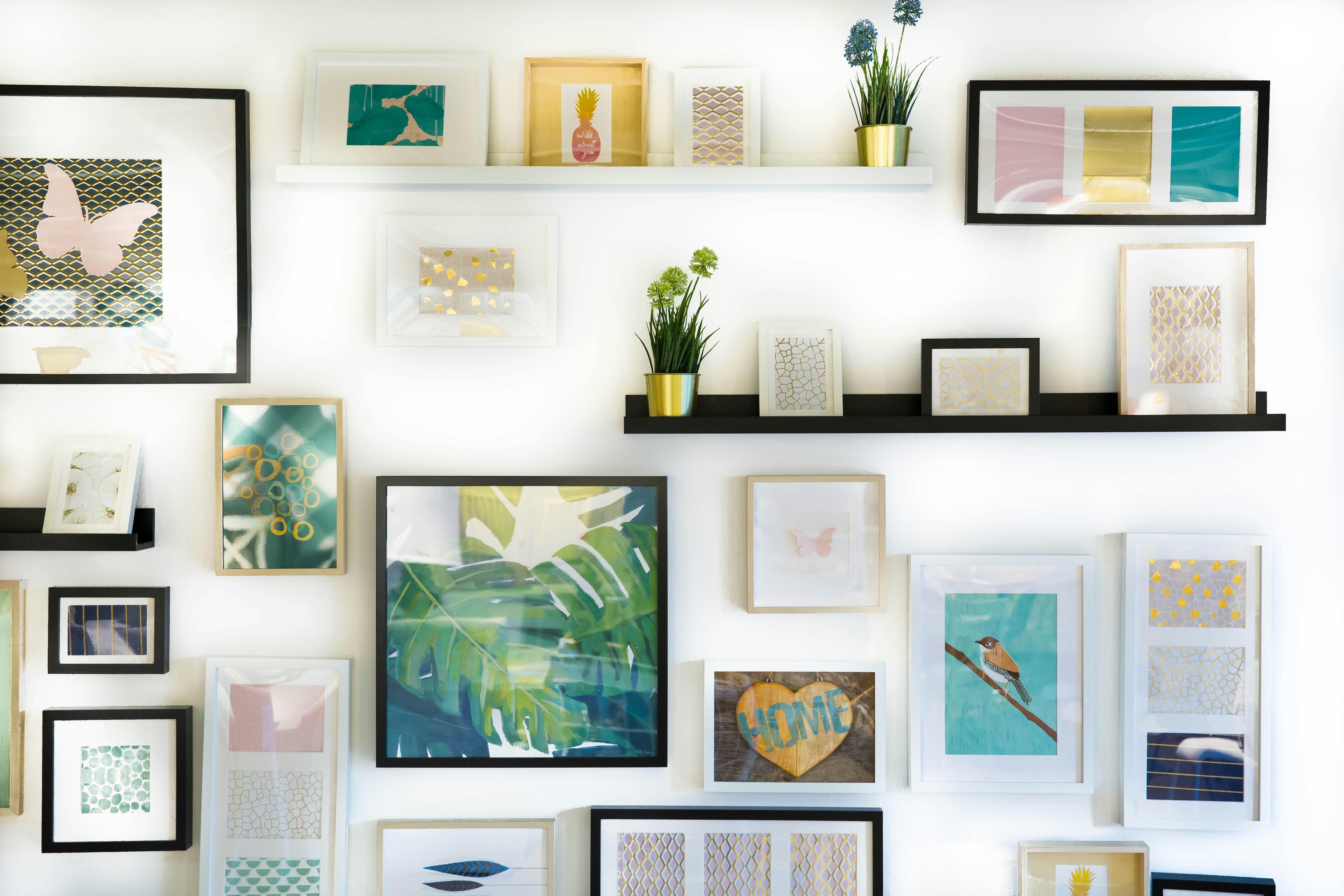 assorted-color framed paintings on the wall assorted-color framed paintings on the wall